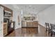Open kitchen design with modern appliances, tile backsplash and dark hardwood floors at 125 Placid Woods Ct, Sanford, FL 32773