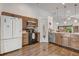 Bright kitchen with stainless steel appliances, wood cabinets, and tile backsplash at 125 Placid Woods Ct, Sanford, FL 32773