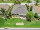Aerial view of landscaped backyard with patio, showcasing home's outdoor living space at 1266 James Island St, The Villages, FL 32162