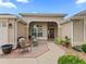 Inviting front porch with outdoor seating and meticulous landscaping, perfect for relaxing at 1266 James Island St, The Villages, FL 32162