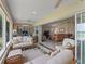 Sunroom featuring comfortable seating and a seamless transition to the living areas at 1266 James Island St, The Villages, FL 32162