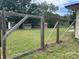 Fenced area of backyard with wooden supports and wire mesh at 145 Ne 71St Ave, Ocala, FL 34470