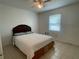 Cozy bedroom features a queen-size bed and natural light from the window at 145 Ne 71St Ave, Ocala, FL 34470