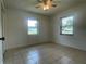 Bedroom showcasing two large windows providing natural light and exterior views at 145 Ne 71St Ave, Ocala, FL 34470