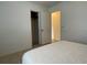 Bedroom with closet and adjacent door showcasing a simple, clean design at 145 Ne 71St Ave, Ocala, FL 34470