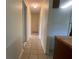 Neutral hallway with tile floors provides access to multiple rooms at 145 Ne 71St Ave, Ocala, FL 34470