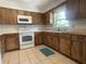 Updated kitchen featuring newer appliances, tile flooring, and modern cabinetry at 145 Ne 71St Ave, Ocala, FL 34470
