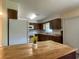 Eat in kitchen featuring an island, tile flooring, and a view to the backyard at 145 Ne 71St Ave, Ocala, FL 34470