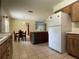 Eat in kitchen featuring an island, tile flooring, and a view to the backyard at 145 Ne 71St Ave, Ocala, FL 34470