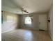 Cozy living room featuring tile floors, neutral paint, and a ceiling fan at 145 Ne 71St Ave, Ocala, FL 34470