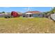 Spacious backyard features a well-maintained lawn and a cozy gazebo area, ideal for outdoor relaxation at 14762 Sw 22Nd Court Rd, Ocala, FL 34473