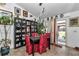 Dining room features a table and four chairs with red covers, tile floors, and a view to the backyard at 14762 Sw 22Nd Court Rd, Ocala, FL 34473