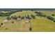 Aerial view of the property, showing fields and structures on land at 15360 Se 73Rd Avenue, Summerfield, FL 34491