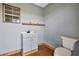 Gray half bathroom with modern sink and vanity, plus wood trim and a toilet at 15360 Se 73Rd Avenue, Summerfield, FL 34491