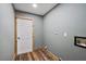 The laundry room has wood trim and a door at 15360 Se 73Rd Avenue, Summerfield, FL 34491