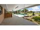 Expansive covered patio overlooking a sparkling pool, lush landscaping and outdoor pavilion at 15360 Se 73Rd Avenue, Summerfield, FL 34491