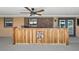 Spacious covered patio bar with ceiling fan, brick accents, and Ducks Unlimited logo at 15360 Se 73Rd Avenue, Summerfield, FL 34491