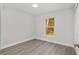 Bright bedroom with wood-look floors and view to outside at 15369 Sw 38Th Pl, Ocala, FL 34481