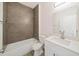 Updated bathroom with a soaking tub, vanity, and modern lighting fixtures at 1686 Sw 168Th Loop, Ocala, FL 34473