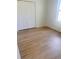 Cozy bedroom with wood flooring, a closet, and natural light from the window at 1686 Sw 168Th Loop, Ocala, FL 34473