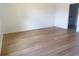 Bedroom with wood-look flooring and a doorway leading to the ensuite bathroom at 1686 Sw 168Th Loop, Ocala, FL 34473