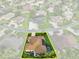 A beautiful home and yard is outlined in yellow in this aerial view of the property at 1953 Hartford Path, The Villages, FL 32162