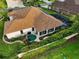 A beautiful yard and screened pool highlight this home's outdoor living spaces at 1953 Hartford Path, The Villages, FL 32162