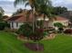 Beautiful single-Gathering home with well-kept lawn, professional landscaping, and inviting curb appeal at 1953 Hartford Path, The Villages, FL 32162