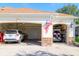 Attached garages offer plenty of parking and storage space with room for a car and golf cart at 1953 Hartford Path, The Villages, FL 32162