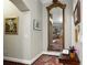 The foyer features a large mirror and access to the living spaces at 1953 Hartford Path, The Villages, FL 32162