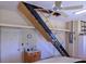 Spacious garage with attic access ladder, ample storage, and a well-maintained interior at 1953 Hartford Path, The Villages, FL 32162