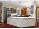 Spacious kitchen boasts an island, modern cabinets, quartz countertops and stainless steel appliances at 1953 Hartford Path, The Villages, FL 32162