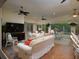 This comfortable Florida room features ceiling fans, comfortable seating, and plenty of light at 1953 Hartford Path, The Villages, FL 32162