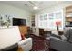 Bright home office with custom built-ins and ample desk space at 1953 Hartford Path, The Villages, FL 32162