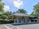 Community post office building featuring ample parking, multiple mailboxes, and landscaped surroundings at 1953 Hartford Path, The Villages, FL 32162