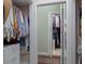 Spacious walk-in closet offers plenty of room for clothes and accessories, with shelves and hanging racks at 1953 Hartford Path, The Villages, FL 32162