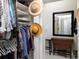 Bright walk-in closet featuring ample storage with a variety of shelves and hanging areas for optimal organization at 1953 Hartford Path, The Villages, FL 32162