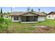 The spacious backyard features a screened porch perfect for outdoor relaxation and entertaining at 21191 Sw Plantation St, Dunnellon, FL 34431