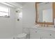Bathroom featuring a tiled shower, brushed gold hardware and updated vanity at 21191 Sw Plantation St, Dunnellon, FL 34431
