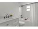 Bright bathroom featuring a tub with shower and a vanity with marble countertops at 21191 Sw Plantation St, Dunnellon, FL 34431
