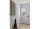 Home entryway featuring a decorative interior door, wood flooring, and a stylish wall decoration at 21191 Sw Plantation St, Dunnellon, FL 34431