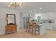 Modern kitchen features white cabinets, stainless steel appliances, and a stylish island with seating at 21191 Sw Plantation St, Dunnellon, FL 34431
