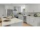 Newly remodeled kitchen with stainless steel appliances, quartz countertops, and modern fixtures at 21191 Sw Plantation St, Dunnellon, FL 34431