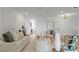 Bright living room features a stylish couch and accent chairs with modern decor and ample natural light at 21191 Sw Plantation St, Dunnellon, FL 34431