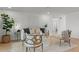 Living area featuring comfortable seating, wood floors, and an open and airy layout at 21191 Sw Plantation St, Dunnellon, FL 34431