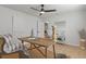 Stylized office area features a wooden desk, modern furnishings and light wood floors at 21191 Sw Plantation St, Dunnellon, FL 34431