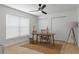 Office features a wooden desk, window with blinds and double door closet at 21191 Sw Plantation St, Dunnellon, FL 34431