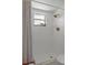 Shower featuring tiled walls and floor, brushed gold fixtures and hardware at 21191 Sw Plantation St, Dunnellon, FL 34431