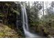 Scenic waterfall cascading down rocks in a lush, natural setting at 21191 Sw Plantation St, Dunnellon, FL 34431