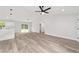 A spacious living room features modern flooring, open layout, and abundant natural light at 2297 Sw 143 Ct, Ocala, FL 34481